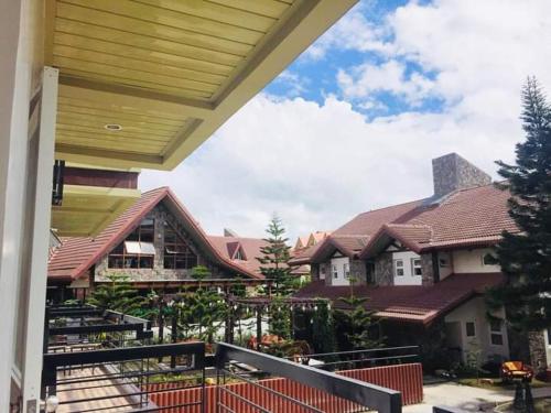 a view of a house from the balcony of a house at Elliannah Pines Hotel in Baguio
