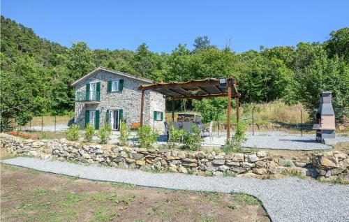 a stone house with a stone fence and a stone wall at Beautiful Home In Framura With Wifi in Framura