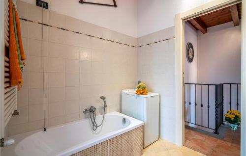 a bathroom with a bath tub in a room at Cà Da Suntina in Varese Ligure