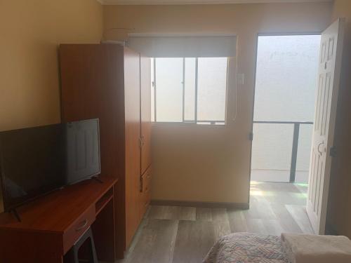 TV a/nebo společenská místnost v ubytování Hostal Iria