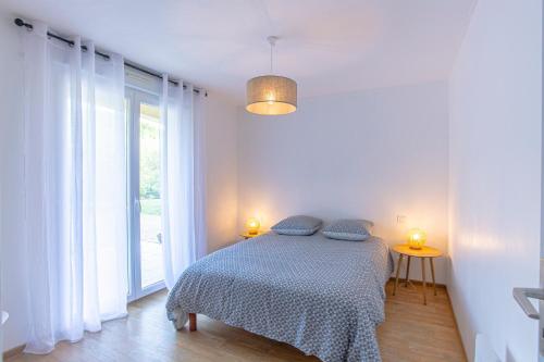 Postel nebo postele na pokoji v ubytování Superbe appartement avec terrasse et vue dégagée