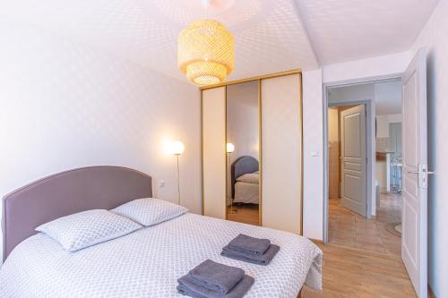 Postel nebo postele na pokoji v ubytování Superbe appartement avec terrasse et vue dégagée