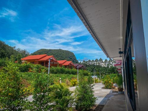 a view of a resort with a mountain in the background at Baan Rung Tawan in Ban Bang Nao