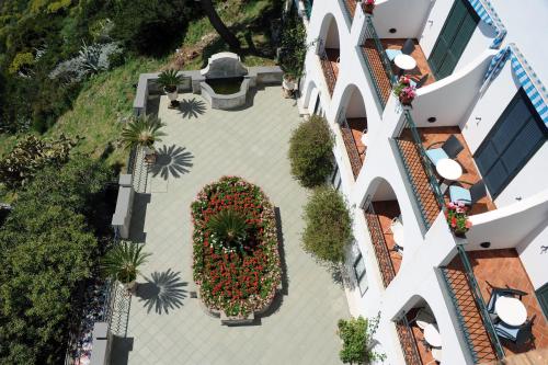an overhead view of a building with a courtyard with plants at Hotel Belvedere in Conca dei Marini
