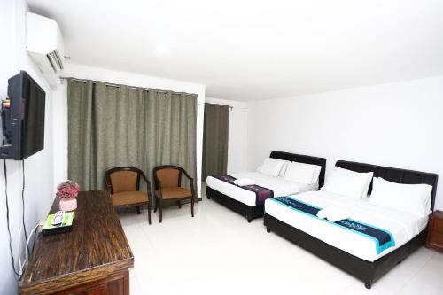 Cama o camas de una habitación en Pondok Muara Chalet