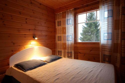 Postelja oz. postelje v sobi nastanitve Himoshovi Cottages