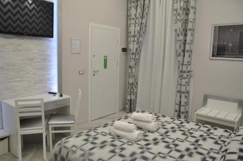 Krevet ili kreveti u jedinici u okviru objekta Il Corso Suite