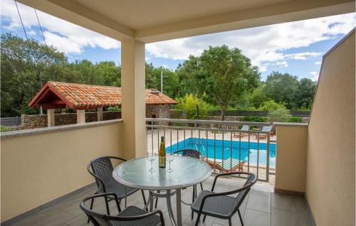a patio with a table and chairs and a pool at Awesome Apartment In Pinezici With Wifi in Pinezici