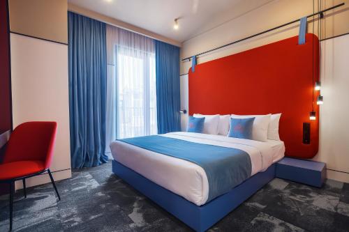 Postel nebo postele na pokoji v ubytování Heritage Hotel and Suites