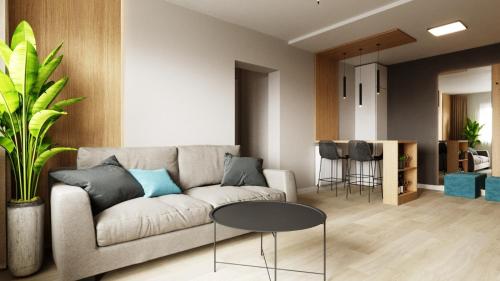 a living room with a couch and a table at FLH - The Nest in Şelimbăr