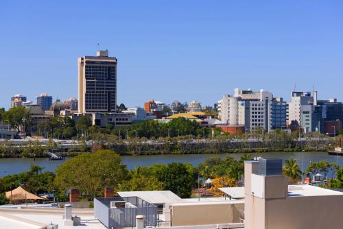 a view of a city with a river and buildings at Mantra South Bank Brisbane in Brisbane