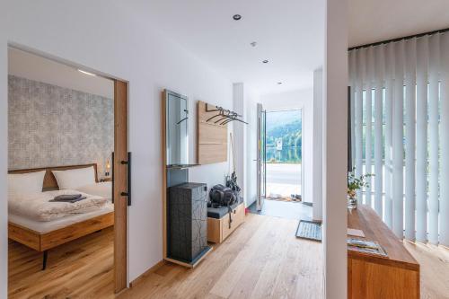 a bedroom with a bed and a mirror at Apartment am Grundlsee in Grundlsee