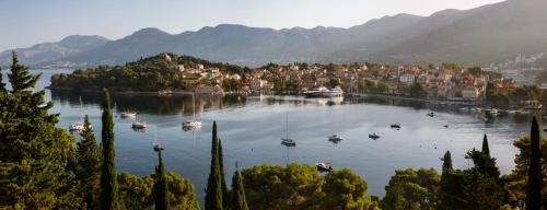a large body of water with boats in it at Hotel Supetar in Cavtat