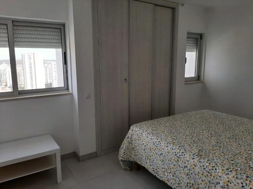 Ένα ή περισσότερα κρεβάτια σε δωμάτιο στο Vue Ocean