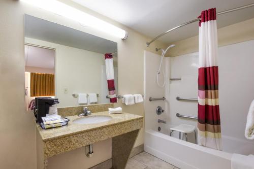 a bathroom with a sink and a shower at Red Roof Inn Shelbyville in Shelbyville