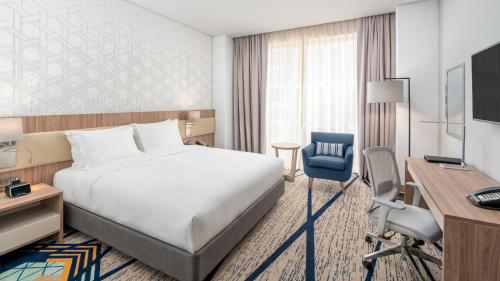 Кровать или кровати в номере Holiday Inn & Suites Al Jubail by IHG