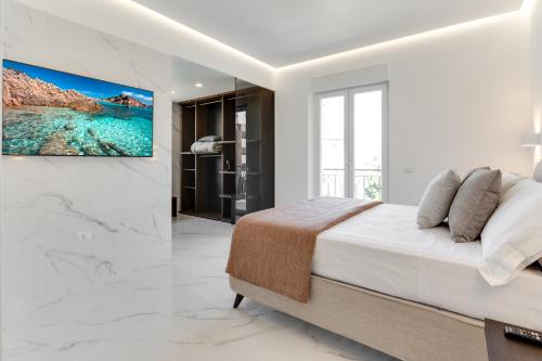 Postel nebo postele na pokoji v ubytování Caralis Suites Rooms