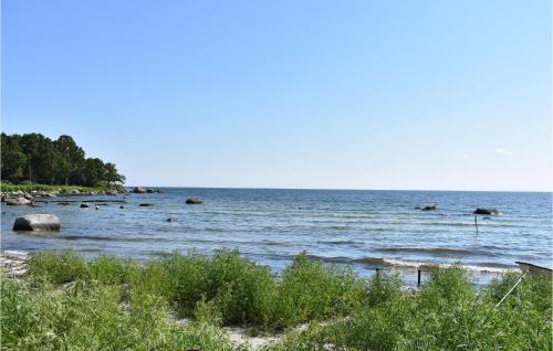 a large body of water with rocks in it at 2 Bedroom Amazing Home In Fjälkinge in Fjälkinge