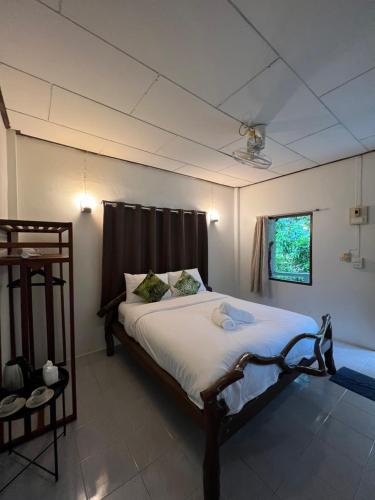 a bedroom with a large bed in a room at Sonic Hill Koh Phangan in Haad Rin