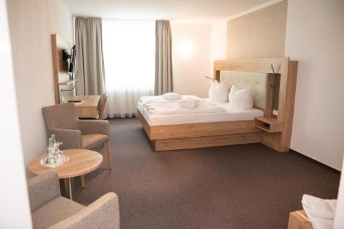 Ліжко або ліжка в номері Hotel Restaurant Große Teichsmühle