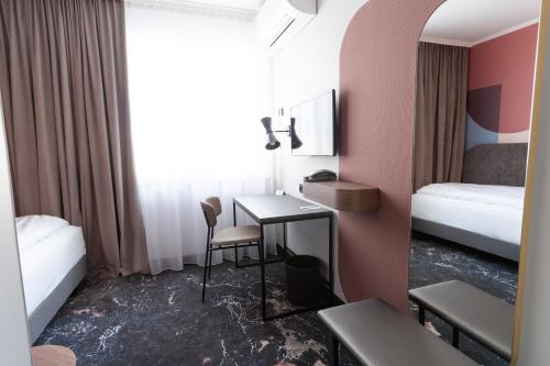 Mercure Mainz City Centerにあるベッド