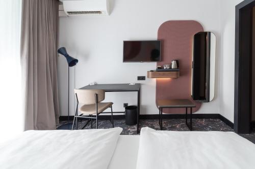 Mercure Mainz City Centerにあるベッド