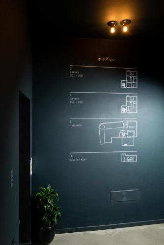 a wall with a picture of a electrical device on it at Gustificio in Carmignano di Brenta