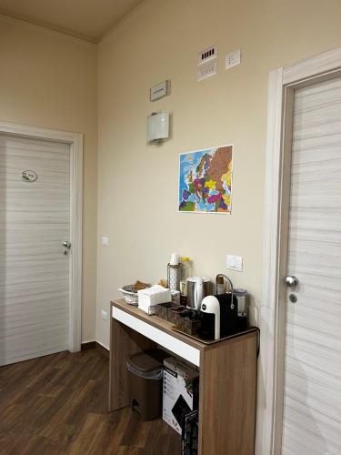 a kitchen with a counter with a sink and aounter at All’Anoneto B&B in Catona