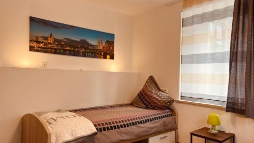 a room with a bench in front of a window at Lotus Home Isny in Isny im Allgäu