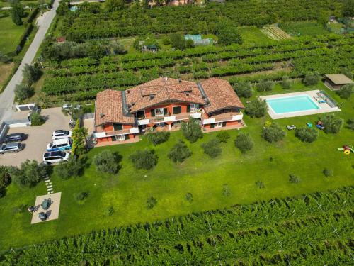 an aerial view of a house with a swimming pool at Agriturismo Maso Bergot in Arco