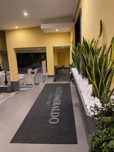 a hotel lobby with a welcome mat on the floor at Hotel Smeraldo in Qualiano