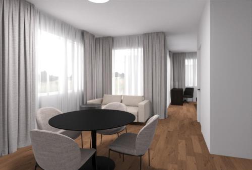 een woonkamer met een tafel en stoelen en een bank bij MOOI Apartments Grenchen in Grenchen