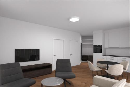een woonkamer met een bank en een tafel en stoelen bij MOOI Apartments Grenchen in Grenchen