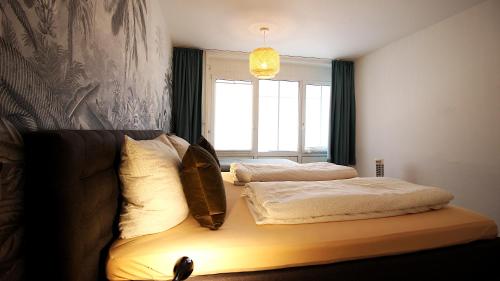 Ένα ή περισσότερα κρεβάτια σε δωμάτιο στο High-quality apartments near Residence - parking space