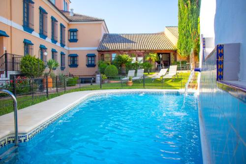 a swimming pool in the middle of a building at YIT Vereda Real in Valencina de la Concepción