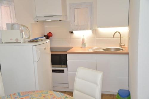 Photo de la galerie de l'établissement Appartement 2 pièces RDC jardin dans résidence avec piscine, à Arzon