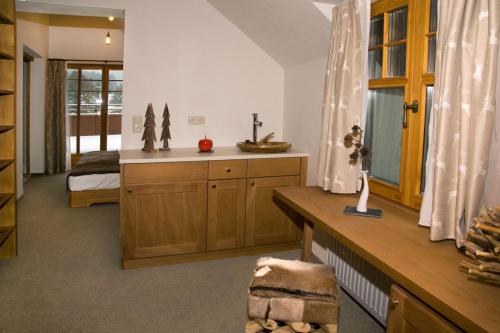 A kitchen or kitchenette at Bödele Alpenhotel