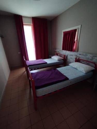 Postel nebo postele na pokoji v ubytování Ostello Torino