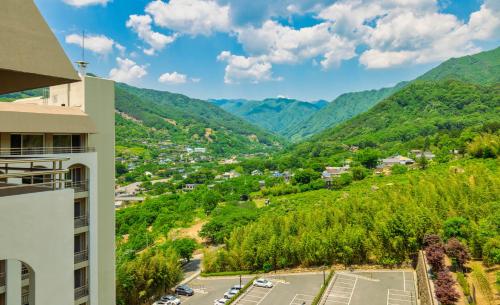 an aerial view of a town with mountains in the background at KensingtonResort JirisanHadong in Hadong