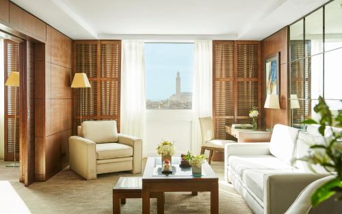 a living room with a couch and a table at Hyatt Regency Casablanca in Casablanca