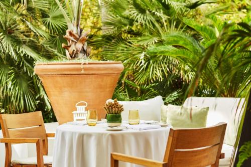 a table with a white table cloth and a plant at Hyatt Regency Casablanca in Casablanca