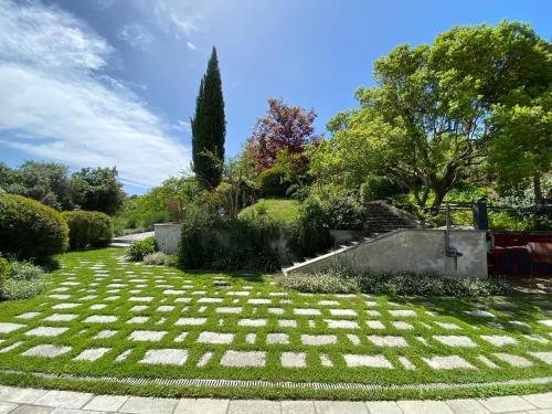 a garden with a lawn with grass and trees at Villa Gatta Bianca in Formello