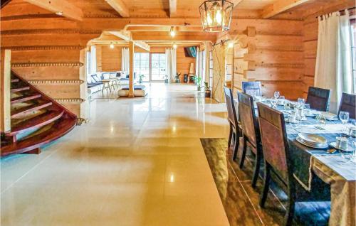 a dining room with a long table in a building at Nice Home In Ustka With Wifi in Ustka