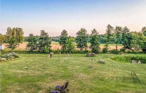 a group of people playing in a grass field at Nice Home In Ustka With Wifi in Ustka