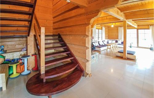 a room with a wooden staircase in a house at Nice Home In Ustka With Wifi in Ustka