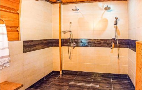 a shower with a glass door in a bathroom at Nice Home In Ustka With Wifi in Ustka
