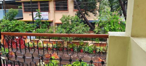 a wrought iron fence in front of a building at Sudeep Bungalow in Alibaug