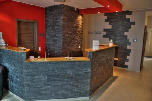 a modern bathroom with a marble counter top at Apado-Hotel garni in Homburg
