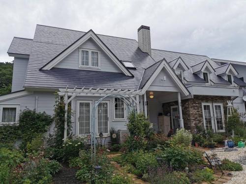 a house with a gray roof at Kitasaku District - Hotel - Vacation STAY 89259 in Kutsukake