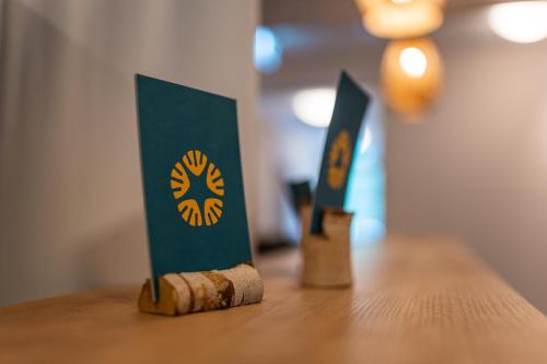a table with two cards on top at Ostsee Apartmenthotel in Graal-Müritz